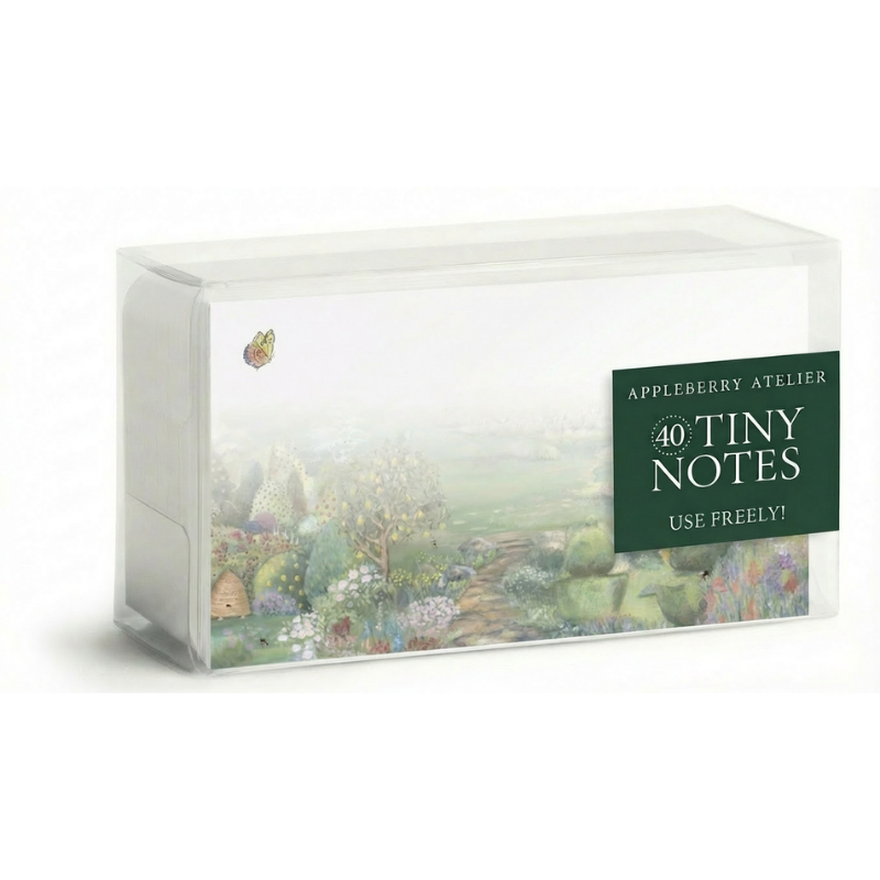 A clear plastic box of Appleberry Atelier 40 Tiny Notes, featuring a whimsical painted landscape illustration on the front with a dark green label on the right side.