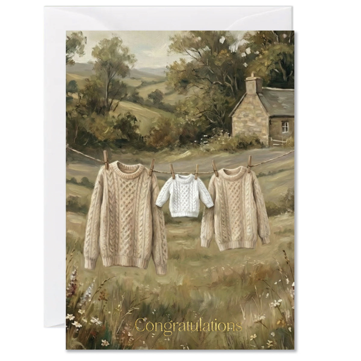 Rustic new baby greeting card featuring knitted sweaters hanging on a countryside washing line with congratulations text