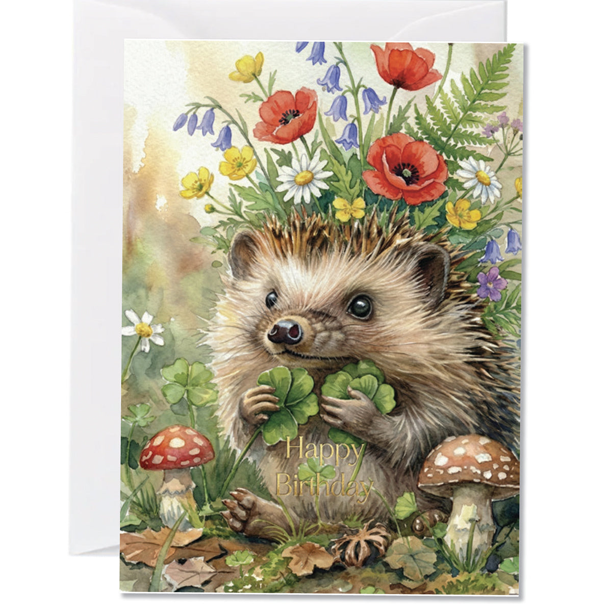 Cute woodland birthday greeting card featuring a hedgehog surrounded by wildflowers clovers and mushrooms with gold Happy Birthday text