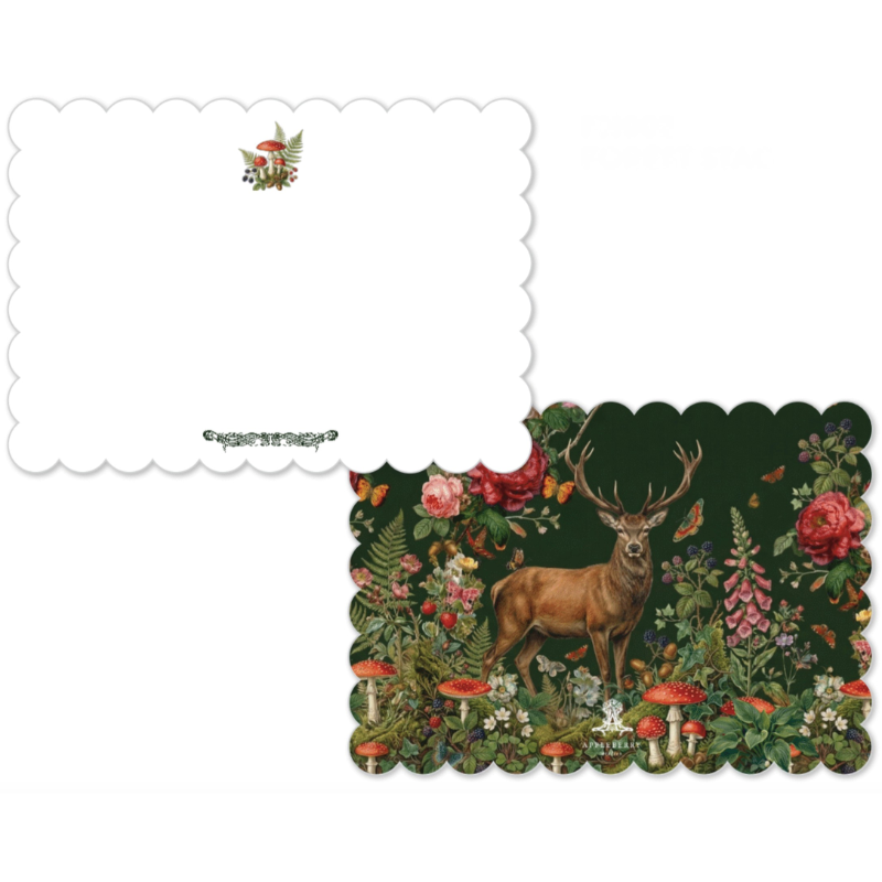 Two scalloped-edge paper cards or envelopes on a white background. One is plain white with a small mushroom illustration and decorative text near the bottom.