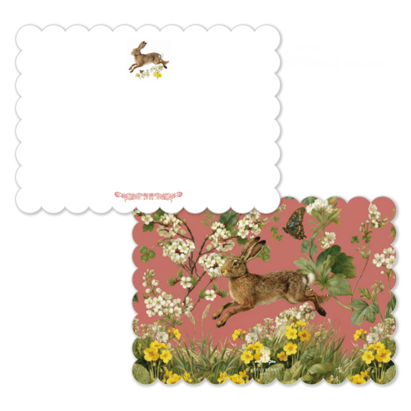 A scalloped-edge greeting card or stationery piece shown on a white background. The lower card features an illustrated scene of a brown hare among white blossoms, green leaves, yellow flowers, and a butterfly on a dusty pink background.