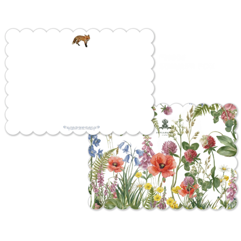 A set of decorative paper cards or envelopes on a white background, featuring a floral border design with red poppies, pink flowers, green leaves, and a small fox illustration on one card.