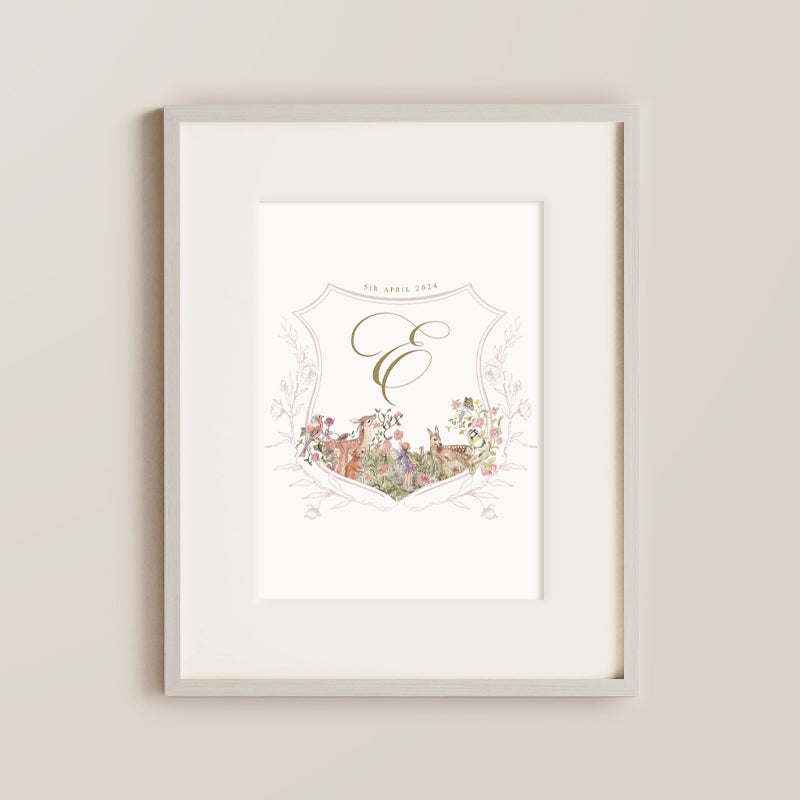 personalised nursery wall art. A pink crest adorned with gentle forest animals, birds, and florals surrounds your baby's initial in a graceful script font. Make it uniquely yours by adding your baby's details for a precious touch of personalisation.