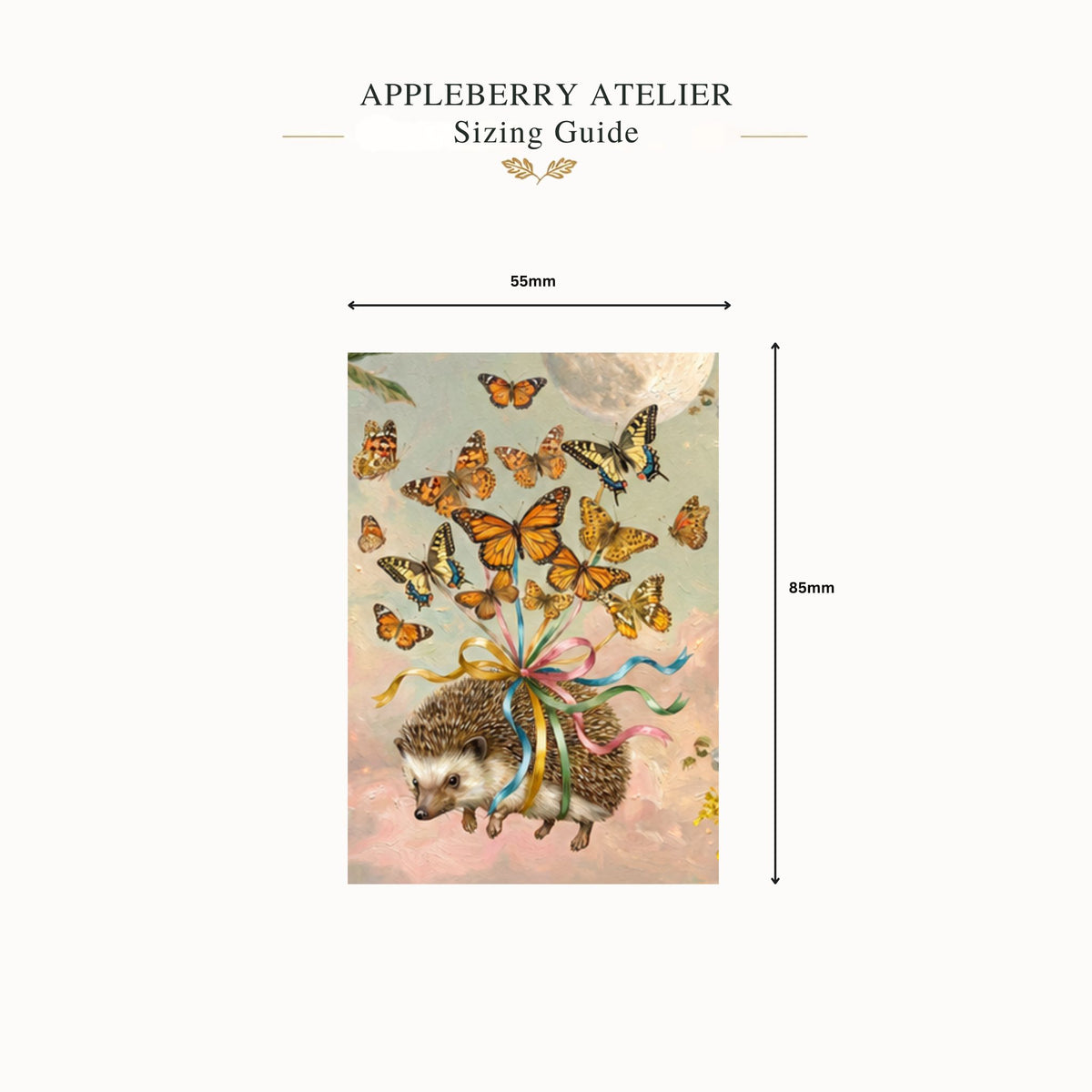 An Appleberry Atelier sizing guide diagram showing a rectangular printed artwork with a hedgehog and butterflies, labeled 55mm by 85mm on a light cream background.