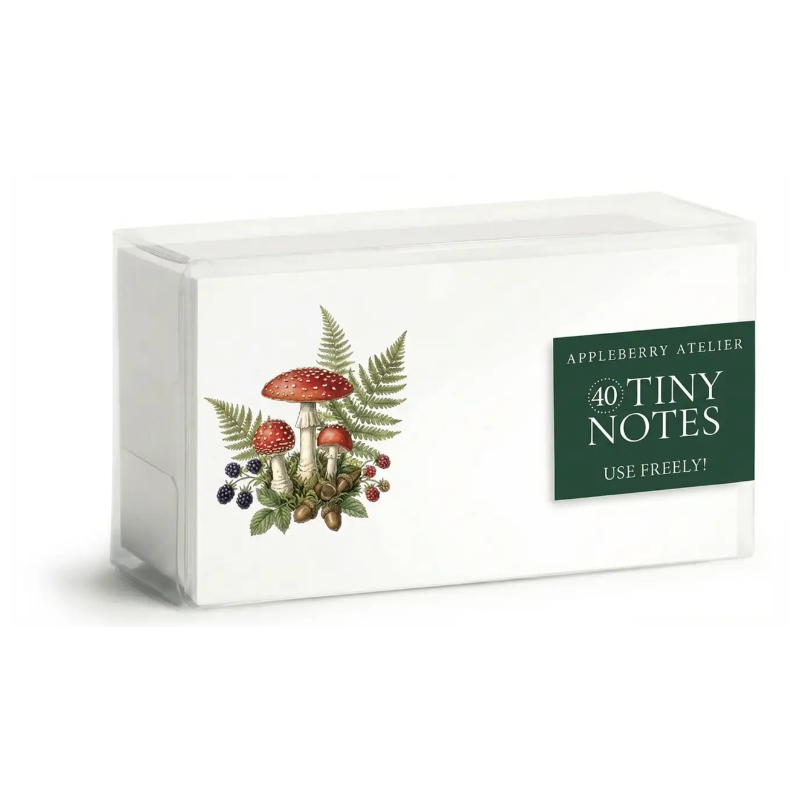 A white rectangular box of Appleberry Atelier 40 Tiny Notes with a green 'USE FREELY!' label and a botanical illustration of mushrooms, ferns, and berries on the front, set against a plain white background.