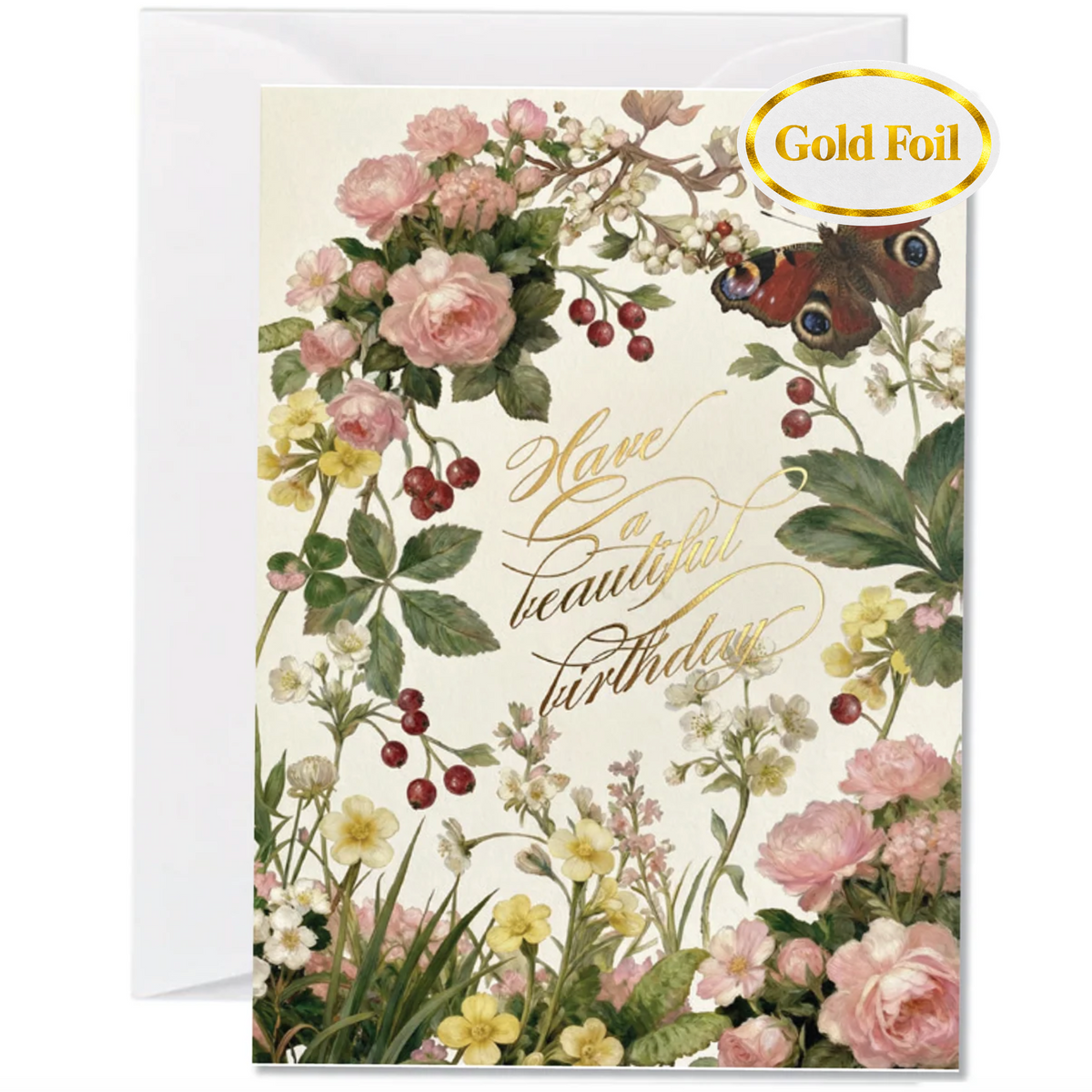A botanical birthday card with a white envelope behind it. The card features a cream background decorated with pink and yellow flowers, green leaves, red berries, butterflies, and elegant gold foil script reading 'Have a beautiful birthday.