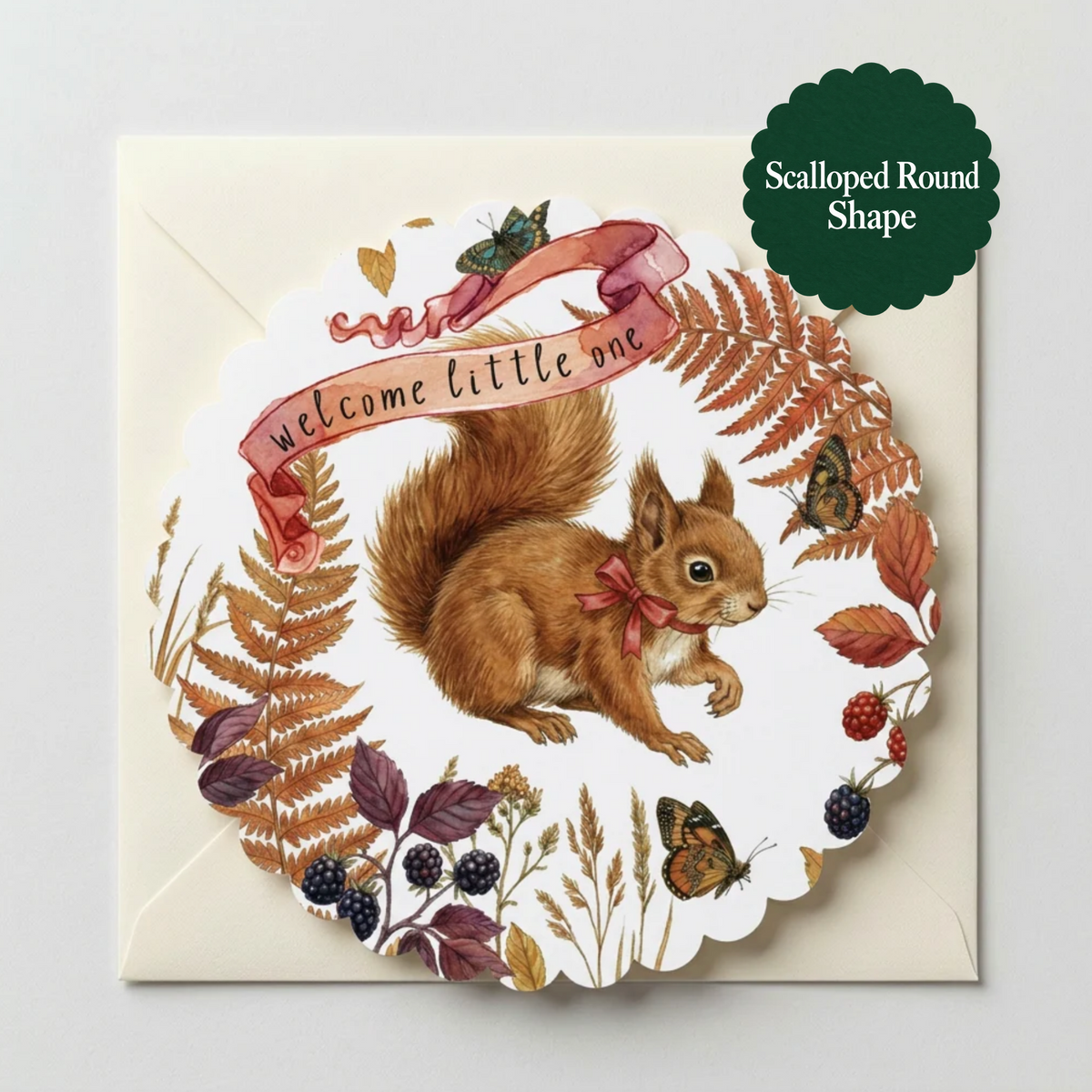 A scalloped round greeting card featuring an illustrated brown squirrel with a pink bow tie, surrounded by autumn leaves, berries, butterflies, and a pink ribbon that reads 'welcome little one.' The card is shown on a white envelope against a light gray background, with a dark green badge in the top right reading 'Scalloped Round Shape.