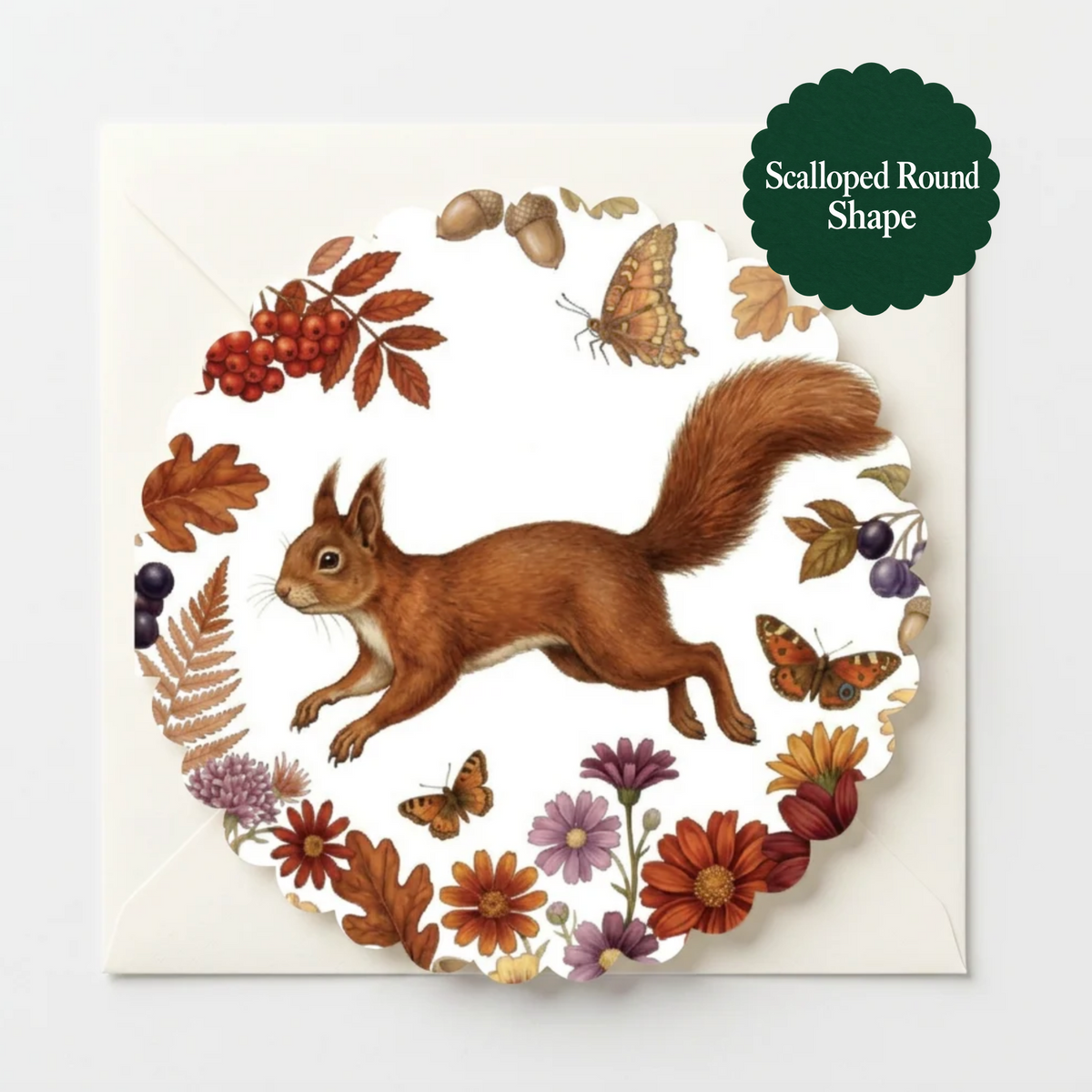 A scalloped round greeting card featuring a watercolor-style illustration of a brown squirrel surrounded by autumn leaves, berries, acorns, and butterflies, shown on a white background with a dark green badge that reads 'Scalloped Round Shape'.