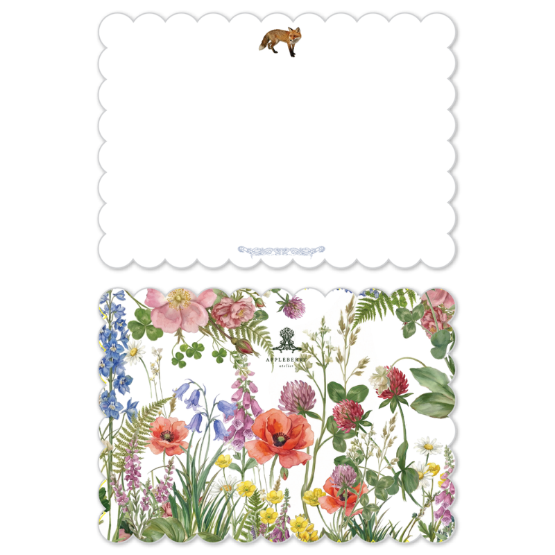 A set of decorative paper napkins or cards with scalloped edges, shown as a flat lay. The top piece is mostly white with a small fox illustration near the top edge and a faint decorative line near the bottom.