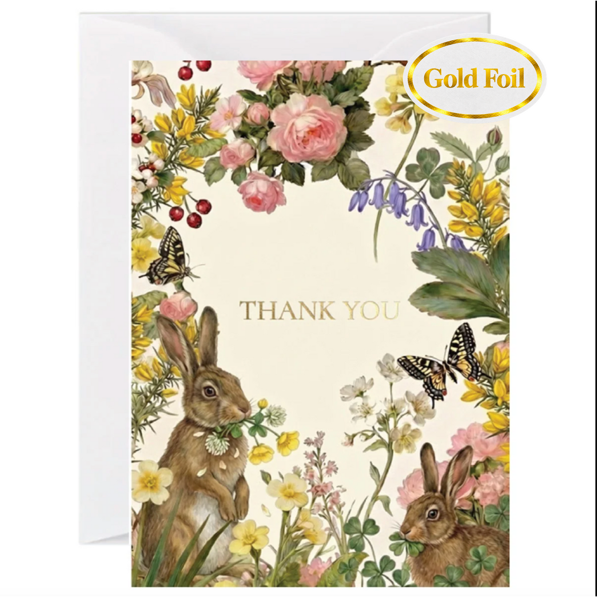 A floral thank you card with a white envelope behind it. The card features an illustrated border of pink flowers, yellow wildflowers, butterflies, and two rabbits, with the words 'THANK YOU' in gold foil-style lettering.
